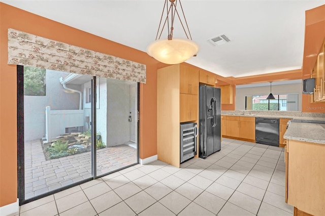 kitchen with wine cooler, light tile patterned floors, hanging light fixtures, and black appliances