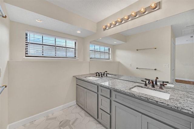 bathroom featuring vanity and a textured ceiling