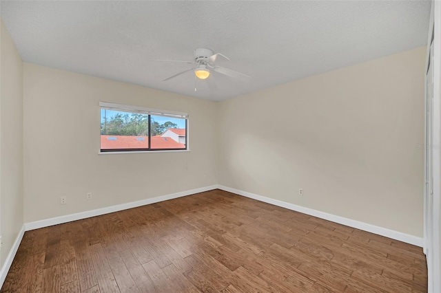 unfurnished room featuring hardwood / wood-style floors and ceiling fan