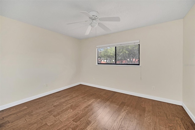 spare room featuring ceiling fan and hardwood / wood-style floors