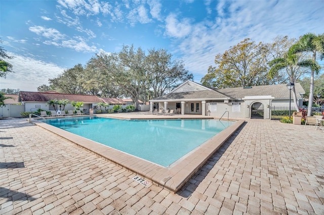 view of swimming pool with a patio