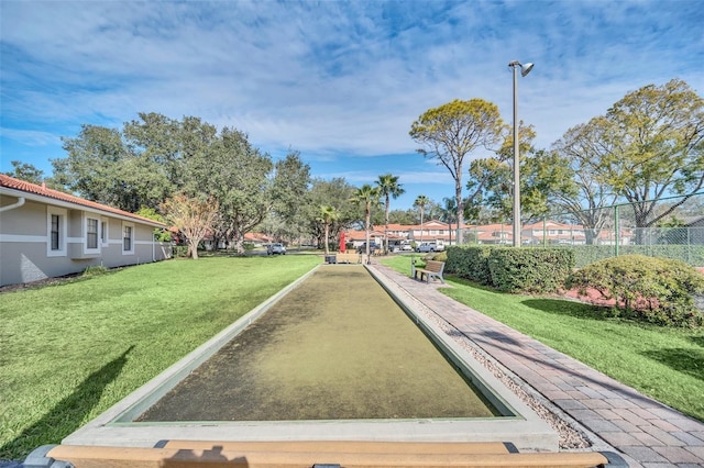 view of property's community featuring a yard