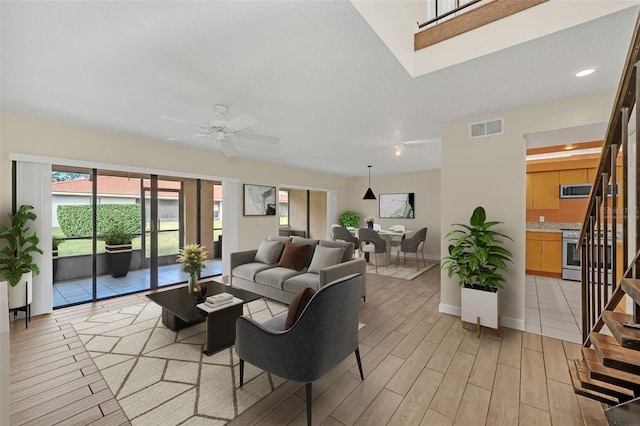 living room with ceiling fan