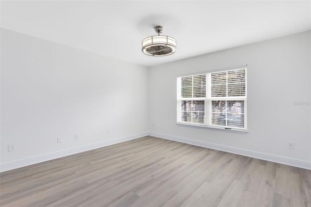 spare room with light hardwood / wood-style floors