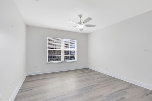 empty room with light hardwood / wood-style floors and ceiling fan