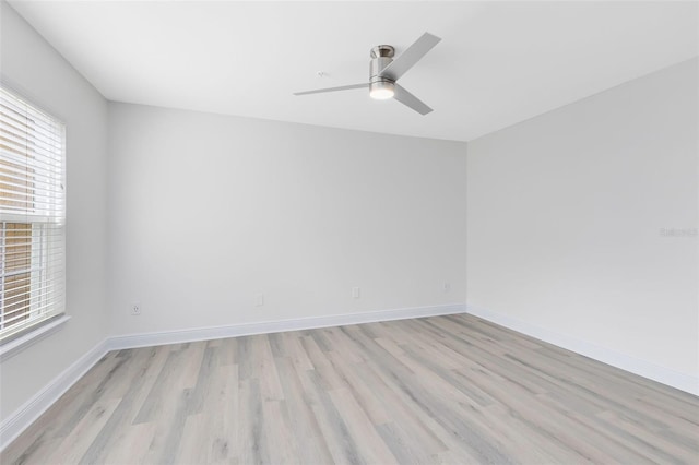 spare room featuring ceiling fan and light hardwood / wood-style floors