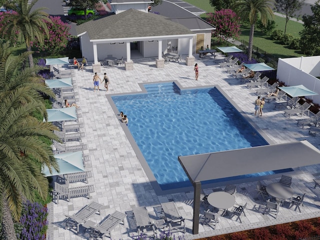 community pool with a patio, outdoor dining area, and fence