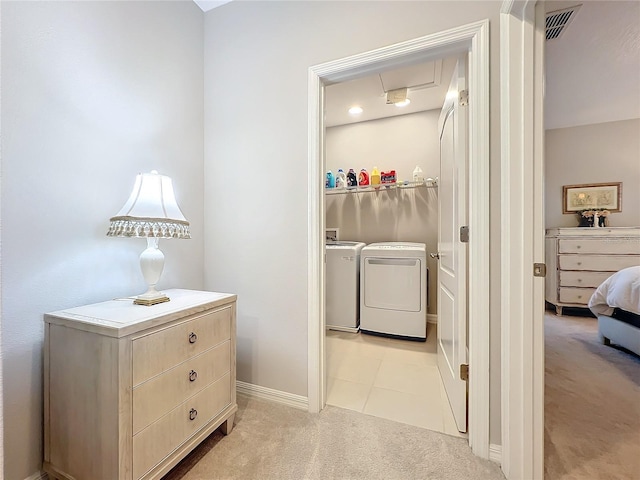 interior space featuring washer and dryer and light colored carpet