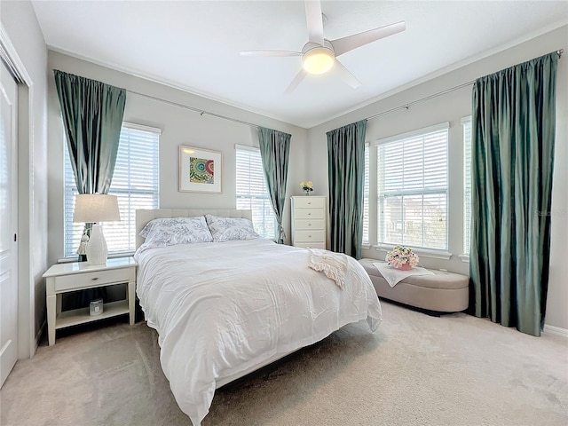 bedroom featuring ceiling fan, a closet, and carpet floors