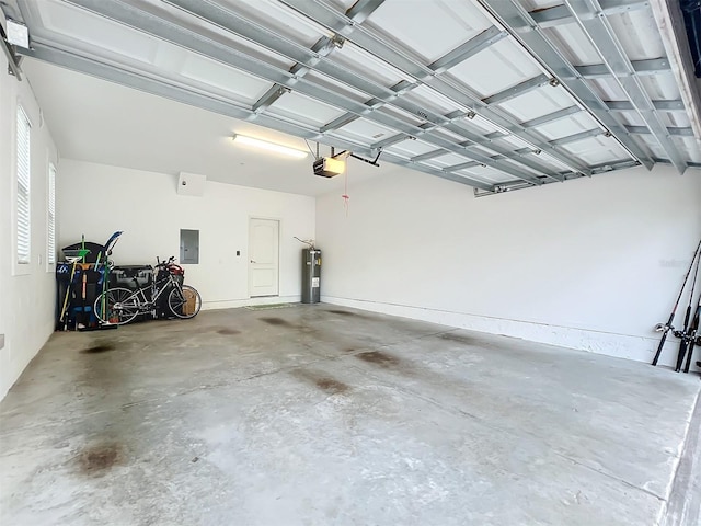 garage with electric water heater, electric panel, and a garage door opener