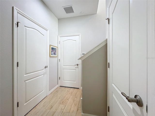 hallway featuring light hardwood / wood-style flooring