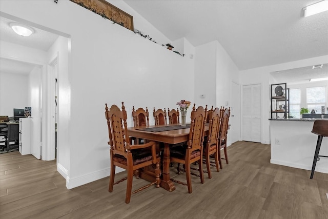 dining area featuring hardwood / wood-style floors