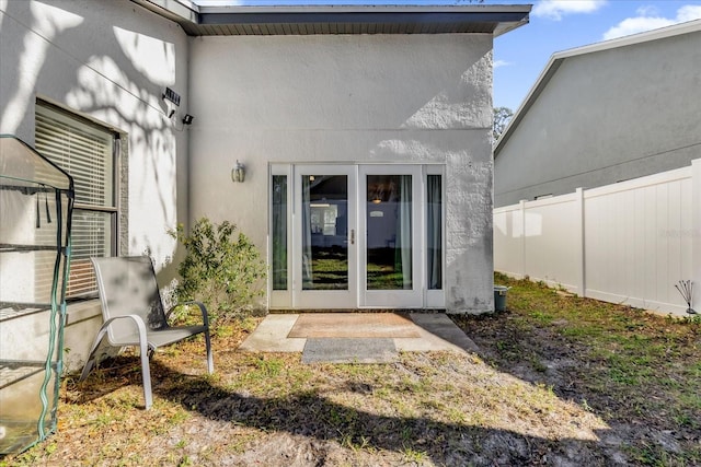 entrance to property featuring french doors