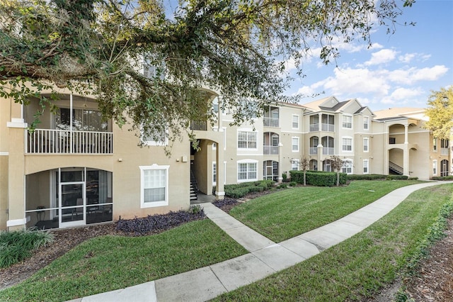 view of home's community featuring a lawn