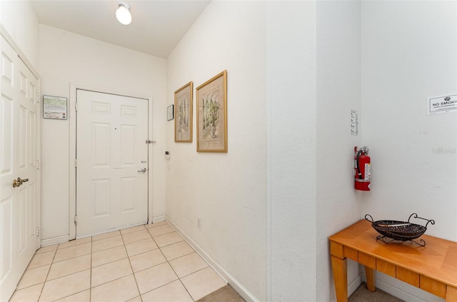 hallway featuring light tile patterned flooring