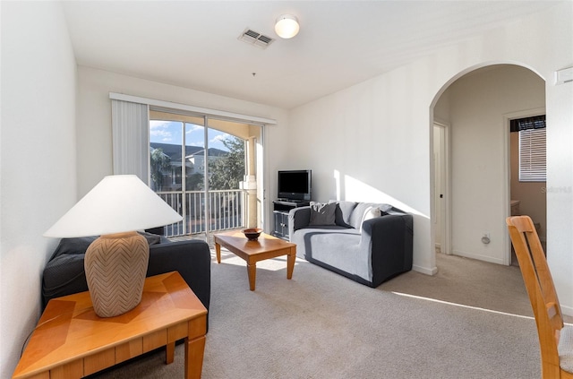 living room with light colored carpet