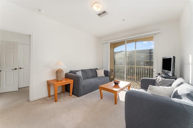 living room featuring light carpet