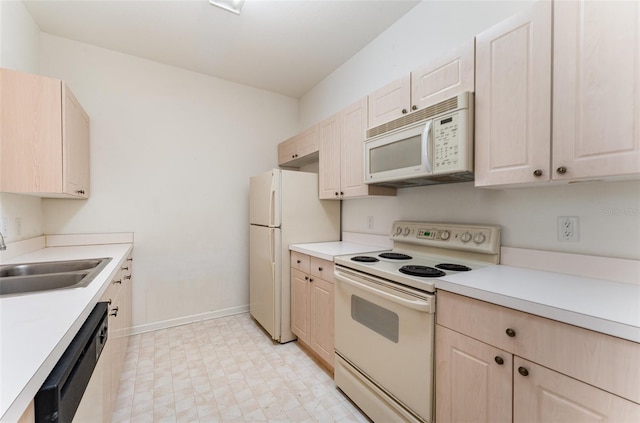 kitchen with white appliances and sink