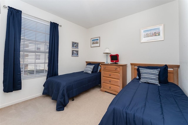 bedroom featuring light colored carpet