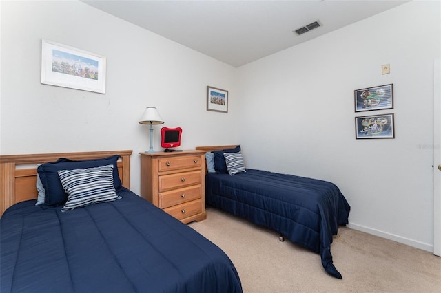 bedroom featuring light carpet