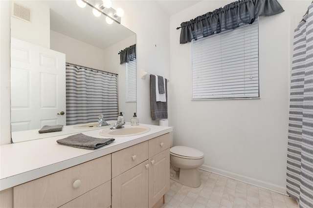 bathroom with vanity and toilet