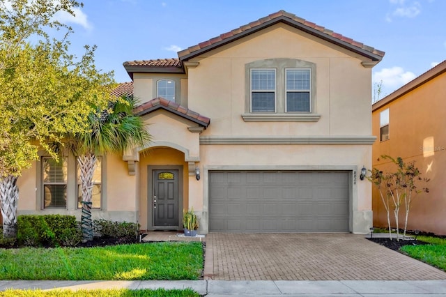 mediterranean / spanish-style home featuring a garage