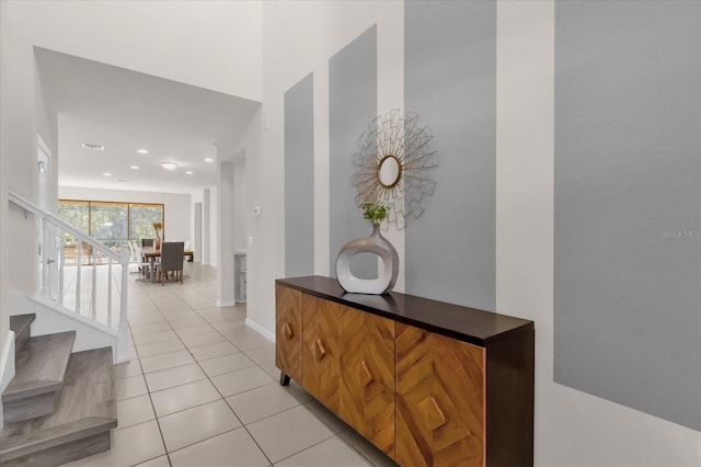 corridor featuring light tile patterned floors