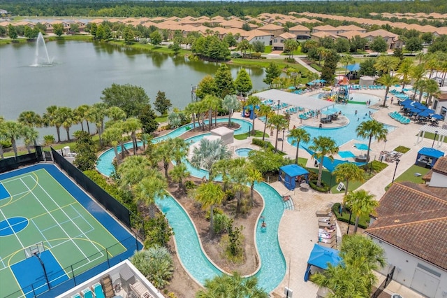 birds eye view of property with a water view