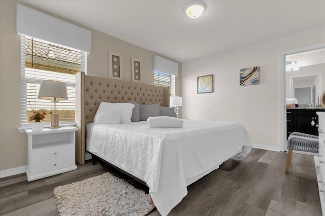 bedroom with dark hardwood / wood-style flooring