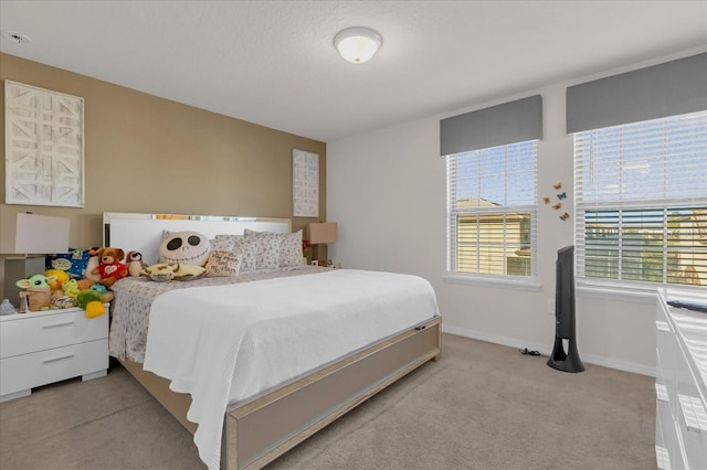 bedroom with light colored carpet