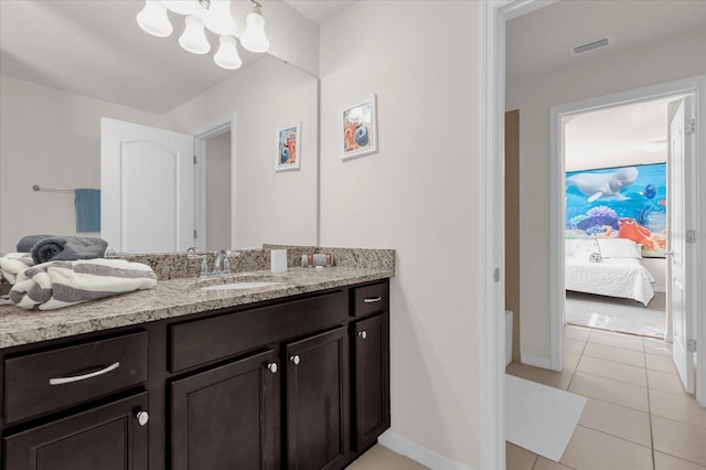 bathroom with tile patterned floors and vanity