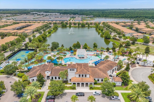 birds eye view of property with a water view