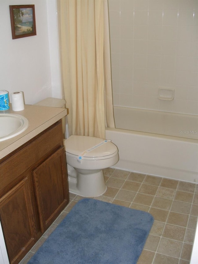 full bathroom with toilet, vanity, and shower / bath combination with curtain