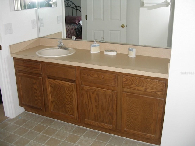 bathroom featuring ceiling fan and vanity