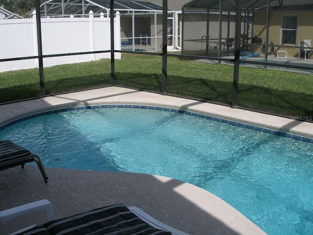 view of pool featuring a yard