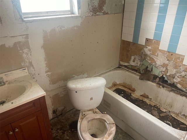 bathroom featuring vanity, toilet, and a bathing tub