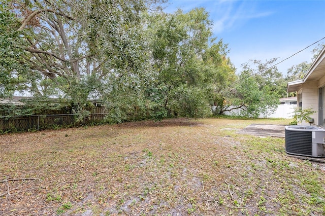 view of yard featuring a patio area and central AC