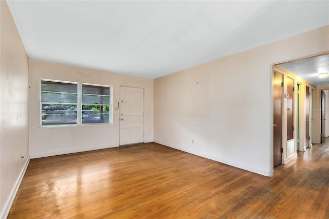 empty room featuring wood-type flooring