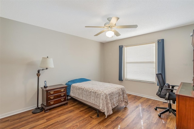 bedroom featuring ceiling fan and wood-type flooring