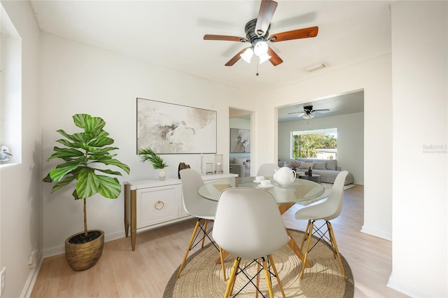 dining room featuring light hardwood / wood-style floors and ceiling fan