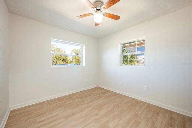 empty room featuring ceiling fan and light hardwood / wood-style floors