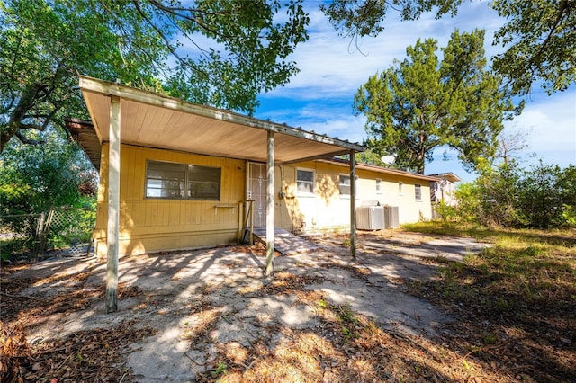 rear view of house with cooling unit