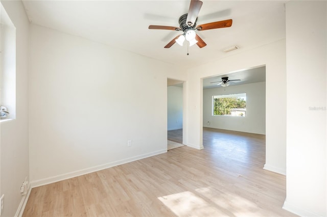 empty room featuring ceiling fan and light wood-type flooring