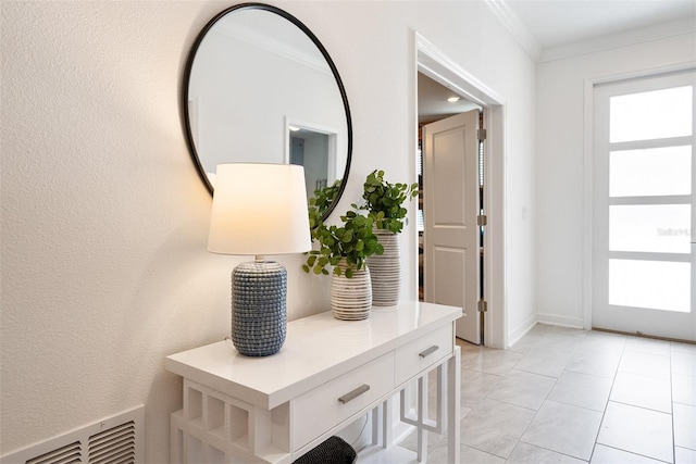 doorway to outside featuring light tile patterned flooring and crown molding