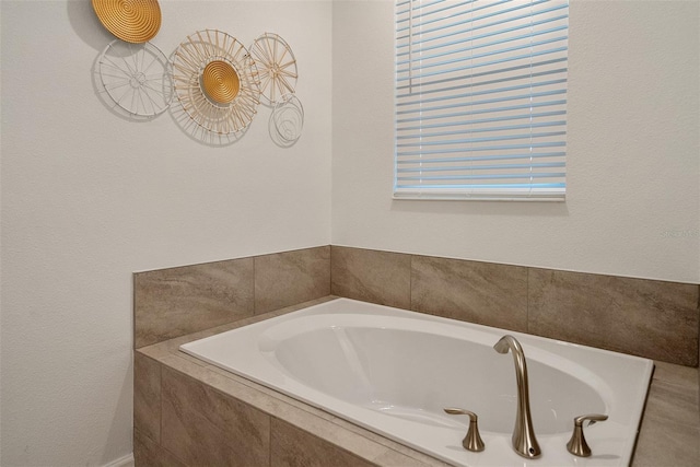 bathroom featuring tiled bath