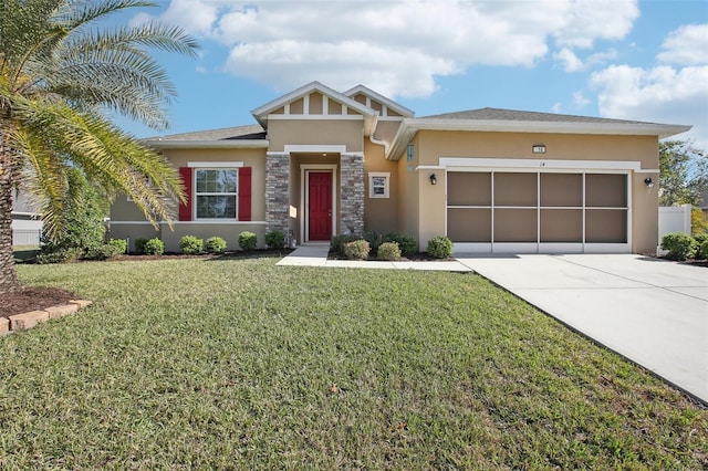 view of front of property with a garage and a front yard