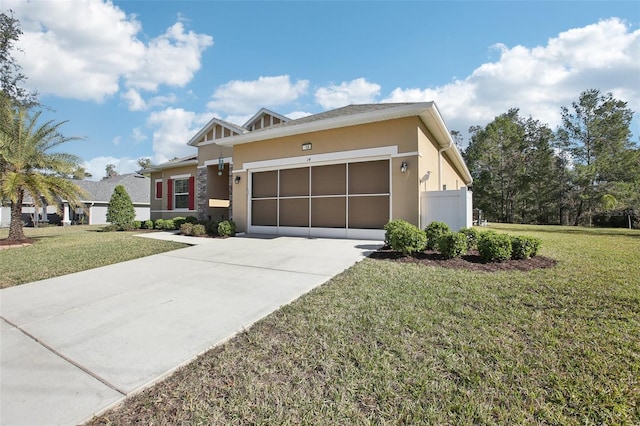 view of front of property featuring a garage and a front yard