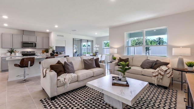 tiled living room with a textured ceiling