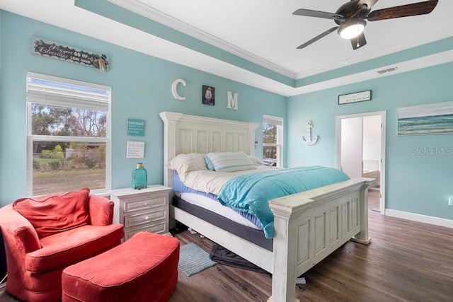 bedroom featuring ceiling fan, dark wood-style flooring, visible vents, baseboards, and crown molding