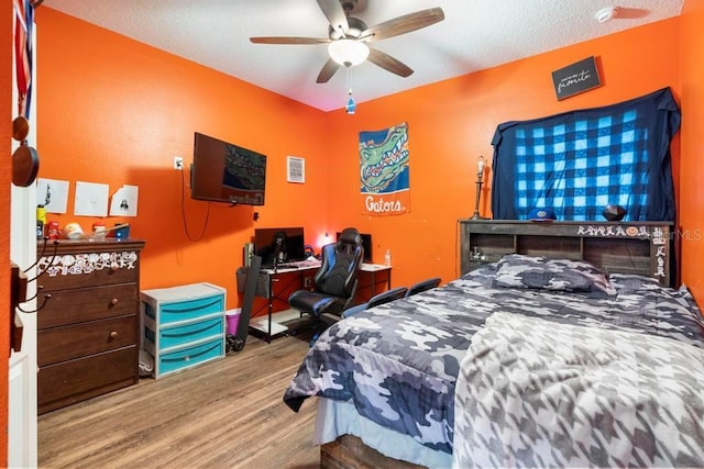 bedroom featuring ceiling fan and wood finished floors